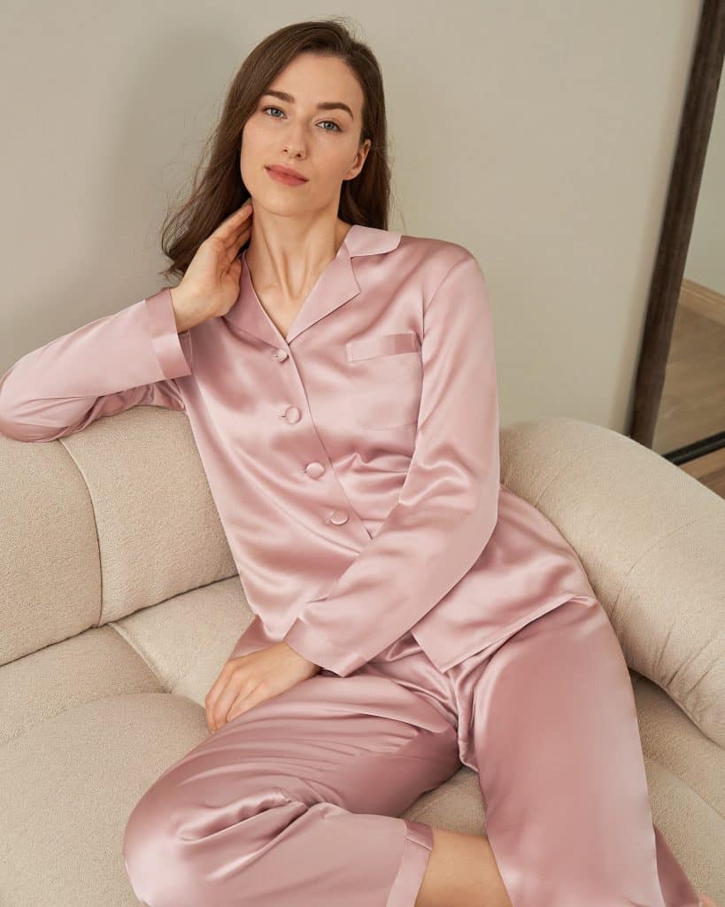 Woman wearing LilySilk Momme pajamas set, considering CakeStyle's best LILYSILK reviews before buying