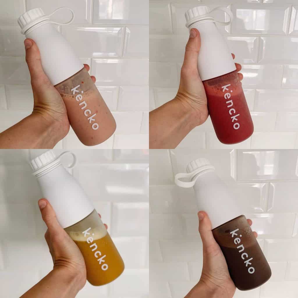 image of my hands holding the 4 kencko smoothies I tried, my honest kencko review